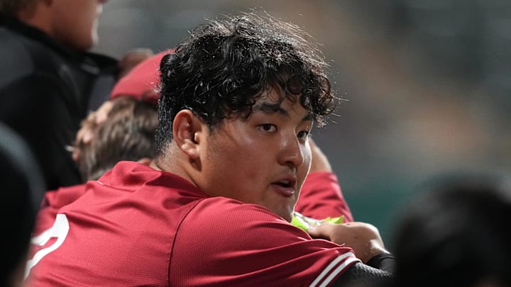 Mar 1, 2025; Stanford, CA, USA; Stanford Cardinal first baseman Rintaro Sasaki (3) leans against the dugout railing during the seventh inning against the Xavier Musketeers at Sunken Diamond. Mandatory Credit: Darren Yamashita-Imagn Images