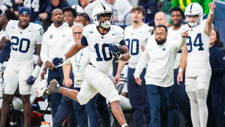Penn State Nittany Lions running back Nicholas Singleton (10) carries the ball during the Big Ten Championship game against the Oregon Ducks at Lucas Oil Stadium.