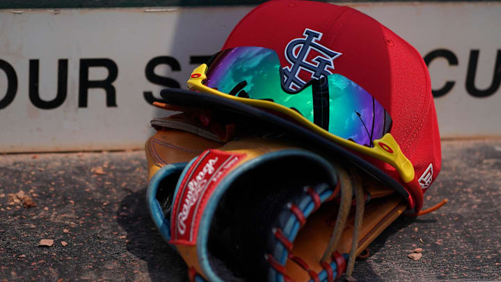 Mar 20, 2018; Jupiter, FL, USA; A St. Louis Cardinals hat with sunglasses sits on a glove in the dugout during a spring training game against the New York Mets at Roger Dean Stadium. Mandatory Credit: Jasen Vinlove-Imagn Images Mar 20, 2018; Jupiter, FL, USA; A St. Louis Cardinals hat with sunglasses sits on a glove in the dugout during a spring training game against the New York Mets at Roger Dean Stadium. Mandatory Credit: Jasen Vinlove-Imagn Images