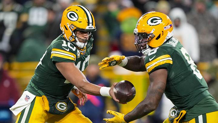 Nov 10, 2025; Green Bay, Wisconsin, USA;  Green Bay Packers quarterback Jordan Love (10) hands the football off to running back Josh Jacobs (8) during the game against the Philadelphia Eagles at Lambeau Field. Mandatory Credit: Jeff Hanisch-Imagn Images