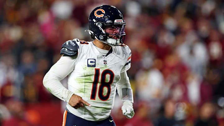 Oct 27, 2024; Landover, Maryland, USA; Chicago Bears quarterback Caleb Williams (18) celebrates after the Bears scored a touchdown during the fourth quarter against the Washington Commanders at Commanders Field. Mandatory Credit: Peter Casey-Imagn Images Oct 27, 2024; Landover, Maryland, USA; Chicago Bears quarterback Caleb Williams (18) celebrates after the Bears scored a touchdown during the fourth quarter against the Washington Commanders at Commanders Field. Mandatory Credit: Peter Casey-Imagn Images