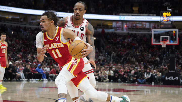 Chicago Bulls forward DeMar DeRozan (11) defends Atlanta Hawks guard Trae Young.