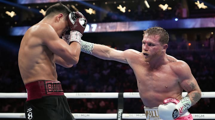 May 7, 2022; Las Vegas, Nevada, USA; Canelo Alvarez (pink trunks) and Dimitry Bivol (black trunks) box during their light heavyweight championship bout at T-Mobile Arena. Mandatory Credit: Joe Camporeale-Imagn Images May 7, 2022; Las Vegas, Nevada, USA; Canelo Alvarez (pink trunks) and Dimitry Bivol (black trunks) box during their light heavyweight championship bout at T-Mobile Arena. Mandatory Credit: Joe Camporeale-Imagn Images