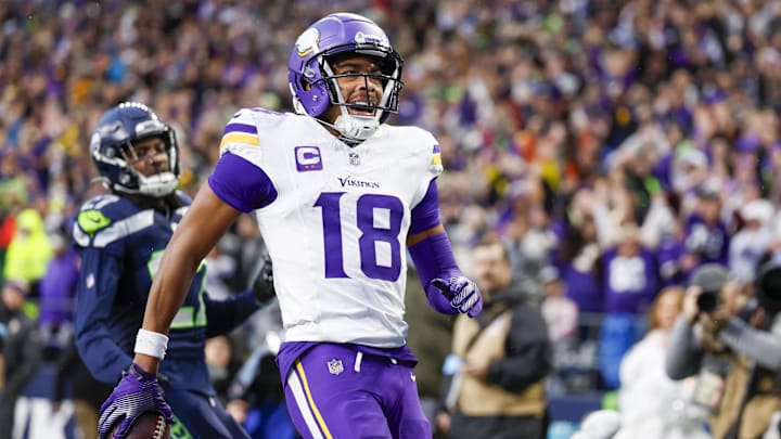 Dec 22, 2024; Seattle, Washington, USA; Minnesota Vikings wide receiver Justin Jefferson (18) celebrates after catching a touchdown pass against the Seattle Seahawks during the fourth quarter at Lumen Field.