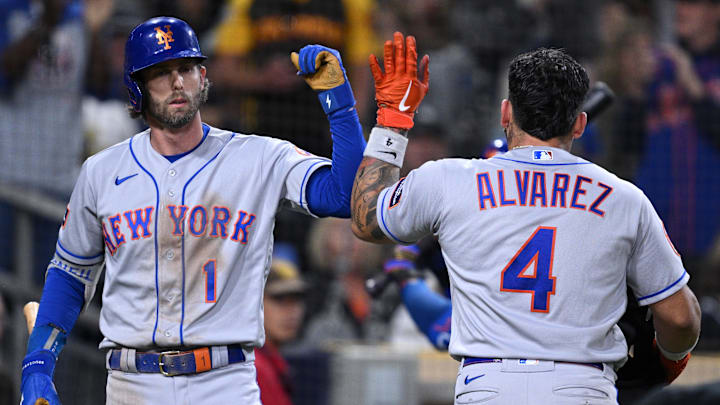 San Diego, California, USA; New York Mets catcher Francisco Alvarez (4) is congratulated by second baseman Jeff McNeil (1) after hitting a home run against the San Diego Padres during the seventh inning at Petco Park. San Diego, California, USA; New York Mets catcher Francisco Alvarez (4) is congratulated by second baseman Jeff McNeil (1) after hitting a home run against the San Diego Padres during the seventh inning at Petco Park.