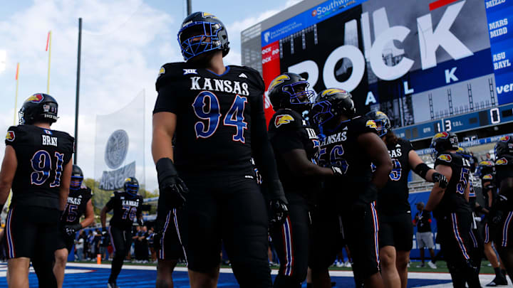 Kansas Jayhawk players warm up before the game against West Virginia Mountaineers at David Booth Kansas Memorial Stadium on Sept. 20, 2025.