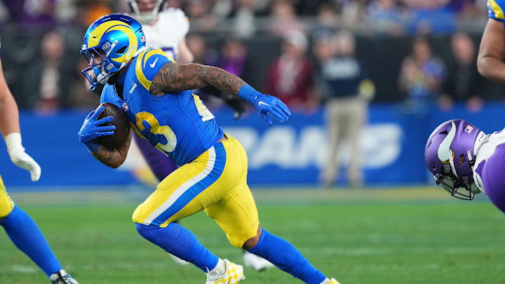 Jan 13, 2025; Glendale, AZ, USA; Los Angeles Rams running back Kyren Williams (23) rushes the ball against the Minnesota Vikings during the first half in an NFC wild card game at State Farm Stadium. Mandatory Credit: Joe Camporeale-Imagn Images