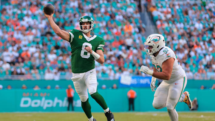 New York Jets quarterback Aaron Rodgers (8) throws the football against the Miami Dolphins during the second quarter at Hard Rock Stadium. New York Jets quarterback Aaron Rodgers (8) throws the football against the Miami Dolphins during the second quarter at Hard Rock Stadium.