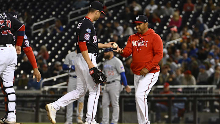 May 1, 2023; Washington, District of Columbia, USA; Washington Nationals starting pitcher MacKenzie Gore (1) is removed from the game by manager Dave Martinez (4) during the fifth inning against the Chicago Cubs at Nationals Park. May 1, 2023; Washington, District of Columbia, USA; Washington Nationals starting pitcher MacKenzie Gore (1) is removed from the game by manager Dave Martinez (4) during the fifth inning against the Chicago Cubs at Nationals Park.