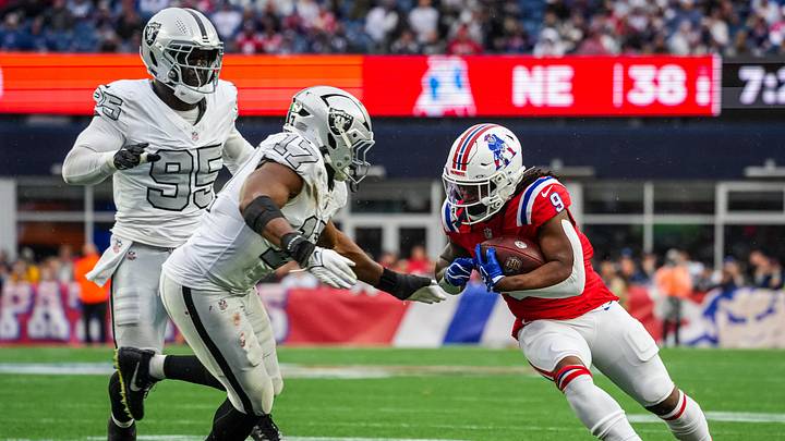 Oct 11, 2026; Foxborough, Massachusetts, USA; New England Patriots running back Corey Kiner (9) runs the ball against Las Vegas Raiders linebacker Nakobe Dean (17) in the second half quarter at Gillette Stadium. Mandatory Credit: David Butler II-Imagn Images Oct 11, 2026; Foxborough, Massachusetts, USA; New England Patriots running back Corey Kiner (9) runs the ball against Las Vegas Raiders linebacker Nakobe Dean (17) in the second half quarter at Gillette Stadium. Mandatory Credit: David Butler II-Imagn Images