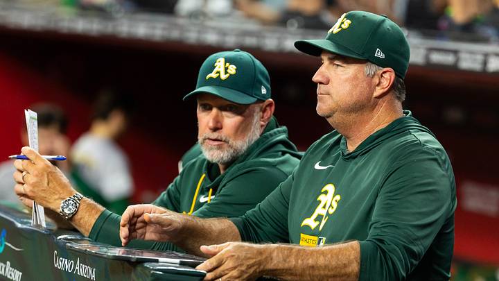 Jul 21, 2026; Phoenix, Arizona, USA; Athletics pitching coach Dan Hubbs (right) with manager Mark Kotsay against the Arizona Diamondbacks at Chase Field. Mandatory Credit: Mark J. Rebilas-Imagn Images Jul 21, 2026; Phoenix, Arizona, USA; Athletics pitching coach Dan Hubbs (right) with manager Mark Kotsay against the Arizona Diamondbacks at Chase Field. Mandatory Credit: Mark J. Rebilas-Imagn Images