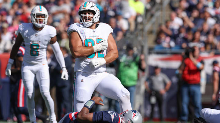 Miami Dolphins defensive tackle Zach Sieler (92) celebrates after a sack of New England Patriots quarterback Jacoby Brissett (7) during the first half at Gillette Stadium.
