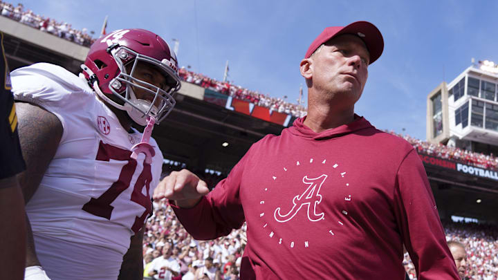 Sep 14, 2024; Madison, Wisconsin, USA;  Alabama Crimson Tide head coach Kalen DeBoer greets offensive lineman Kadyn Proctor (74) prior to the game against the Wisconsin Badgers at Camp Randall Stadium. Mandatory Credit: Jeff Hanisch-Imagn Images
