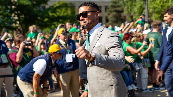 Oct 4, 2025; South Bend, Indiana, USA; Notre Dame Fighting Irish head coach Marcus Freeman gives a thumbs up to fans while walking to the stadium before a game against the Boise State Broncos at Notre Dame Stadium. Mandatory Credit: Michael Caterina-Imagn Images Oct 4, 2025; South Bend, Indiana, USA; Notre Dame Fighting Irish head coach Marcus Freeman gives a thumbs up to fans while walking to the stadium before a game against the Boise State Broncos at Notre Dame Stadium. Mandatory Credit: Michael Caterina-Imagn Images