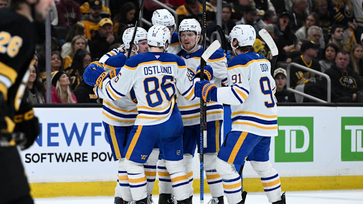 Apr 23, 2026; Boston, Massachusetts, USA; Buffalo Sabres defenseman Bowen Byram (4) celebrates with his teammates after scoring a goal against the Boston Bruins during the second period of game three of the first round of the 2026 Stanley Cup Playoffs at the TD Garden. Mandatory Credit: Brian Fluharty-Imagn Images