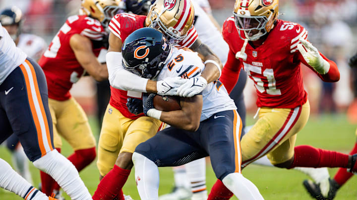 Running back Darrynton Evans is swarmed against the 49ers on a carry in a 38-13 Bears loss.