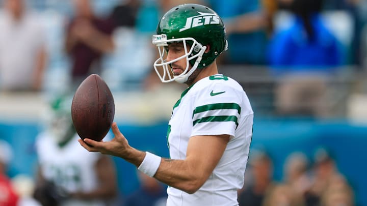 New York Jets quarterback Aaron Rodgers (8) balances a ball before an NFL football matchup Sunday, Dec. 15, 2024 at EverBank Stadium in Jacksonville, Fla.