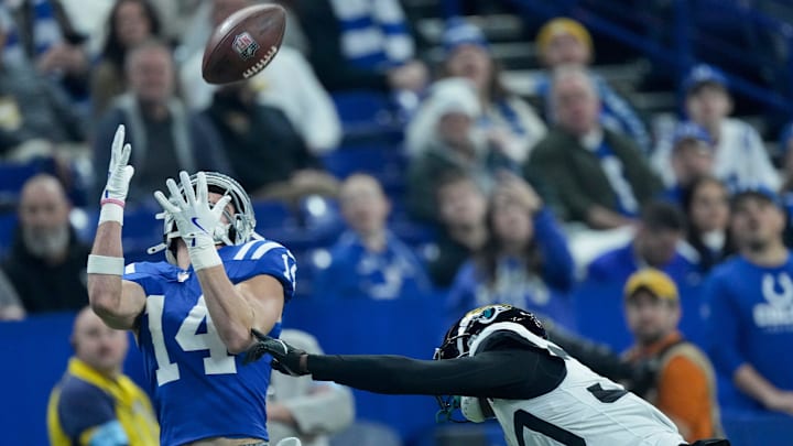Indianapolis Colts wide receiver Alec Pierce (14) makes a catch for a touchdown in front of Jacksonville Jaguars cornerback Montaric Brown (30) on Sunday, Jan. 5, 2025, during a game against the Jacksonville Jaguars at Lucas Oil Stadium in Indianapolis.