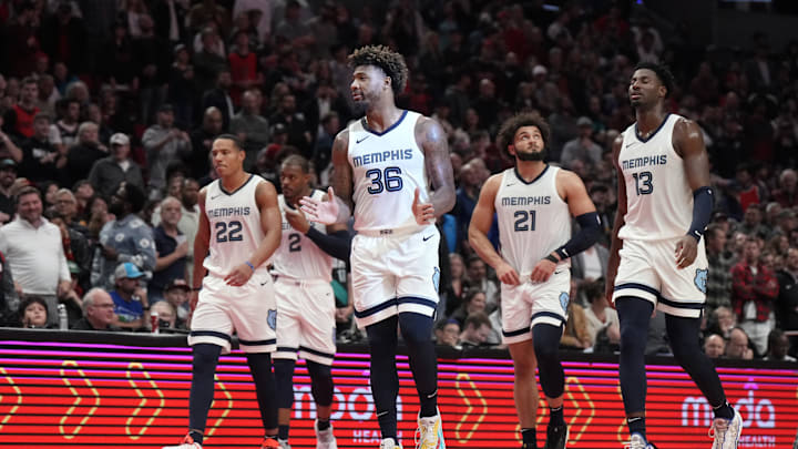 Nov 3, 2023; Portland, Oregon, USA; Memphis Grizzlies shooting guard Desmond Bane (22), Xavier Tillman (2), Marcus Smart (36), David Roddy (21), and Jaren Jackson Jr. (13) walk back to the court after a timeout during the second half against the Portland Trail Blazers at Moda Center. Mandatory Credit: Soobum Im-Imagn Images