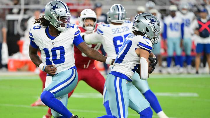 Dallas Cowboys QB Joe Milton III hands off to RB Malik Davis in the first half against the Arizona Cardinals. Dallas Cowboys QB Joe Milton III hands off to RB Malik Davis in the first half against the Arizona Cardinals.