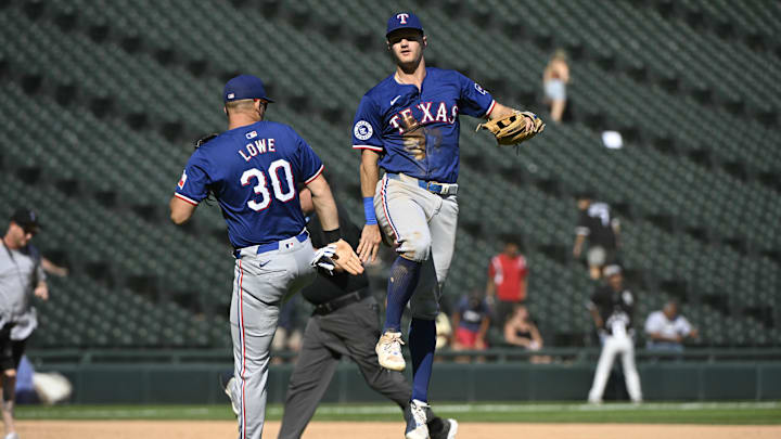 Aug 29, 2024; Chicago, Illinois, USA; Texas Rangers first baseman Nathaniel Lowe (30) and third baseman Josh Jung (6) celebrate after the game against the Chicago White Sox at Guaranteed Rate Field. Mandatory Credit: Matt Marton-USA TODAY Sports Aug 29, 2024; Chicago, Illinois, USA; Texas Rangers first baseman Nathaniel Lowe (30) and third baseman Josh Jung (6) celebrate after the game against the Chicago White Sox at Guaranteed Rate Field. Mandatory Credit: Matt Marton-USA TODAY Sports