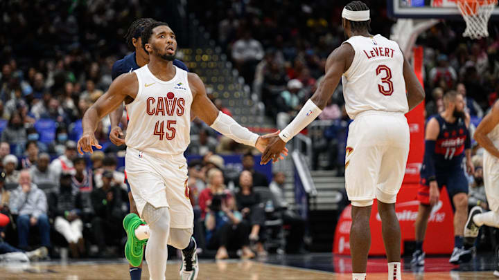 Oct 26, 2024; Washington, District of Columbia, USA; Cleveland Cavaliers guard Donovan Mitchell (45) celebrates with Cleveland Cavaliers guard Caris LeVert (3) after a made shot during the second quarter against the Washington Wizards at Capital One Arena. Mandatory Credit: Reggie Hildred-Imagn Images