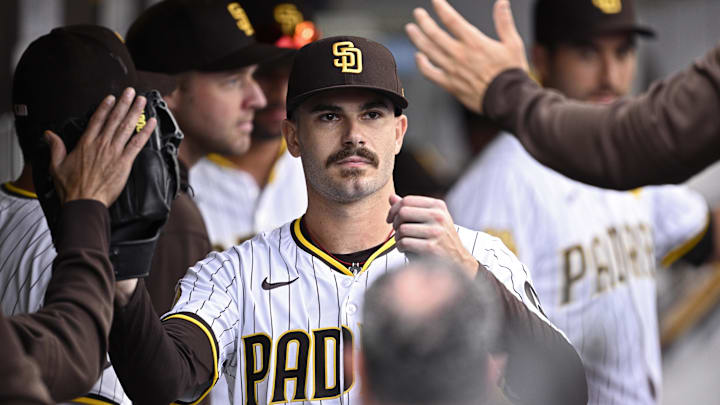 Sep 18, 2024; San Diego, California, USA; San Diego Padres starting pitcher Dylan Cease (84) is congratulated in the dugout after a pitching change in the ninth inning against the Houston Astros at Petco Park. Mandatory Credit: Orlando Ramirez-Imagn Images