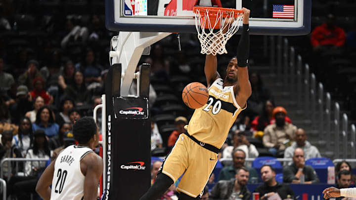 Nov 16, 2025; Washington, District of Columbia, USA; Washington Wizards center Alex Sarr (20) makes a slam dunk in front to Brooklyn Nets center Day'Ron Sharpe (20) during the first quarter at Capital One Arena. Mandatory Credit: Rafael Suanes-Imagn Images Nov 16, 2025; Washington, District of Columbia, USA; Washington Wizards center Alex Sarr (20) makes a slam dunk in front to Brooklyn Nets center Day'Ron Sharpe (20) during the first quarter at Capital One Arena. Mandatory Credit: Rafael Suanes-Imagn Images