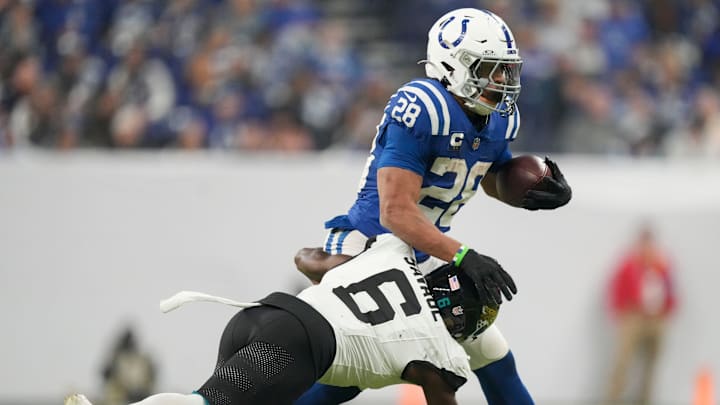 Indianapolis Colts running back Jonathan Taylor (28) is brought down by Jacksonville Jaguars safety Darnell Savage (6) on Sunday, Jan. 5, 2025, during a game against the Jacksonville Jaguars at Lucas Oil Stadium in Indianapolis. Indianapolis Colts running back Jonathan Taylor (28) is brought down by Jacksonville Jaguars safety Darnell Savage (6) on Sunday, Jan. 5, 2025, during a game against the Jacksonville Jaguars at Lucas Oil Stadium in Indianapolis.