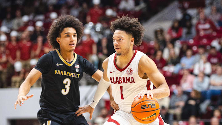 Jan 21, 2025; Tuscaloosa, Alabama, USA; Alabama Crimson Tide guard Mark Sears (1) drives the ball against Vanderbilt Commodores guard Tyler Tanner (3) during the second half at Coleman Coliseum. Mandatory Credit: Will McLelland-Imagn Images