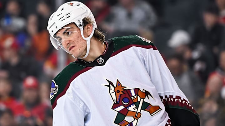 Apr 14, 2024; Calgary, Alberta, CAN; Arizona Coyotes defenseman Michael Kesselring (5) looks on against the Calgary Flames during the first period at Scotiabank Saddledome. Mandatory Credit: Brett Holmes-Imagn Images