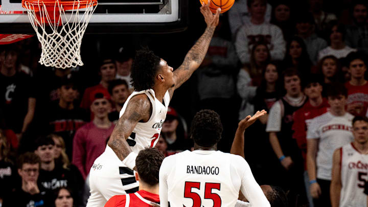 Cincinnati Bearcats forward Dillon Mitchell (23) blocks a shot by Ohio State Buckeyes guard Bruce Thornton (2) in the first half of a basketball scrimmage between Cincinnati Bearcats and Ohio State Buckeyes at Fifth Third Arena in Cincinnati on Friday, Oct. 18, 2024.