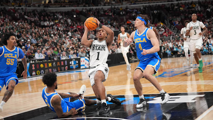 Mar 13, 2026; Chicago, IL, USA; Michigan State Spartans guard Jeremy Fears Jr. (1) shoots the ball over UCLA Bruins guard Donovan Dent (2) during the first half at United Center. Mandatory Credit: David Banks-Imagn Images