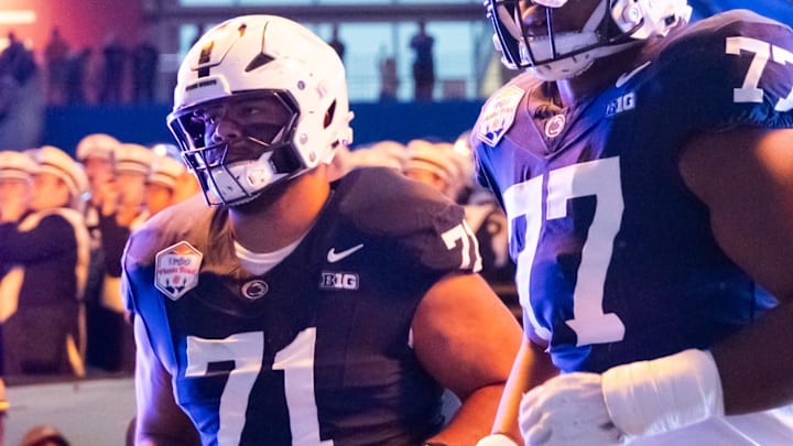 Dec 31, 2024; Glendale, AZ, USA; Penn State Nittany Lions offensive linesman Sal Wormley (77) and offensive lineman Olaivavega Ioane (71) against the Boise State Broncos during the Fiesta Bowl at State Farm Stadium. Mandatory Credit: Mark J. Rebilas-Imagn Images