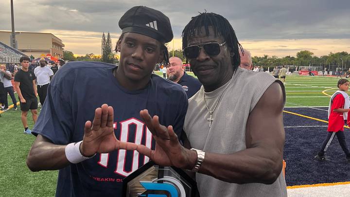Columbus athlete and Miami commit A'mir Sears with former University of Miami star and Pro Football Hall of Famer Michael Irvin at St. Thomas Aquinas on Aug. 29, 2026.