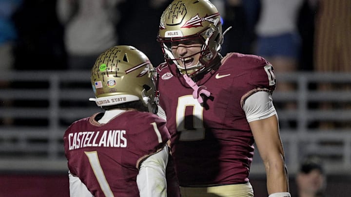 Nov 1, 2025; Tallahassee, Florida, USA; Florida State Seminoles quarterback Tommy Castellanos (1) celebrates a touchdown with wide receiver Duce Robinson (0) during the second half against the Wake Forest Demon Deacons at Doak S. Campbell Stadium. Mandatory Credit: Melina Myers-Imagn Images