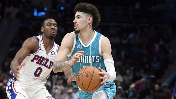 Dec 16, 2024; Charlotte, North Carolina, USA; Charlotte Hornets guard LaMelo Ball (1) drives past Philadelphia 76ers guard Tyrese Maxey (0) during the second half at the Spectrum Center. Mandatory Credit: Sam Sharpe-Imagn Images Dec 16, 2024; Charlotte, North Carolina, USA; Charlotte Hornets guard LaMelo Ball (1) drives past Philadelphia 76ers guard Tyrese Maxey (0) during the second half at the Spectrum Center. Mandatory Credit: Sam Sharpe-Imagn Images