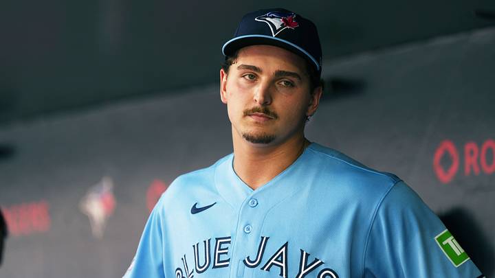 Ricky Tiedemann stands in the dugout against the New York Yankees. Credit: Nick Turchiaro-Imagn Images