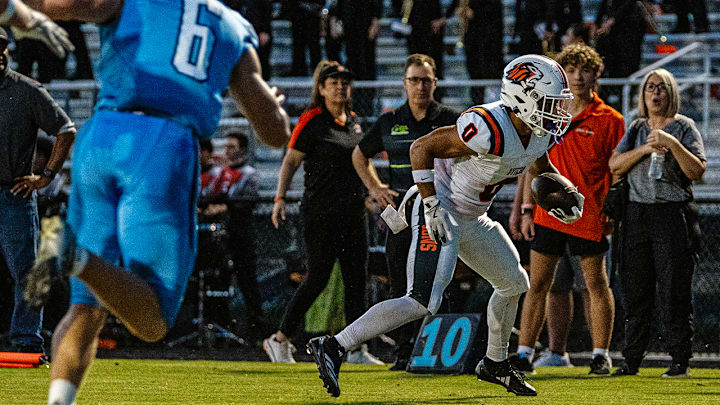Oviedo High wide receiver Emiliano Galarza (0) looks for running room against Hagerty in a 2024 regular-season game. Galarza is one of multiple key returnees this year for the Lions.