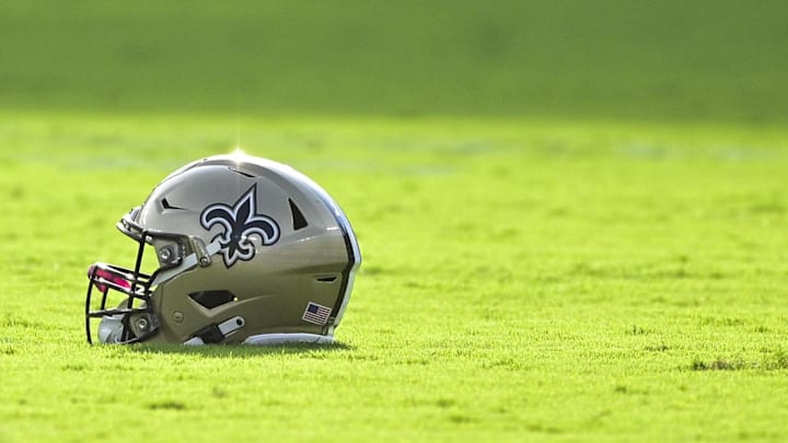 Aug 14, 2021; Baltimore, Maryland, USA;  A detail view of a New Orleans Saints helmet on the field before the game  against the Baltimore Ravens at M&T Bank Stadium. Mandatory Credit: Tommy Gilligan-Imagn Images