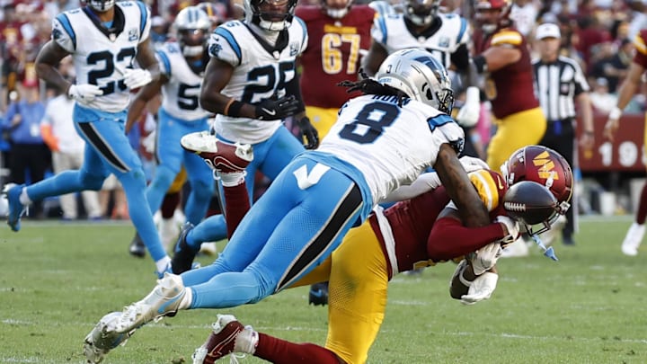 Oct 20, 2024; Landover, Maryland, USA; Carolina Panthers cornerback Jaycee Horn (8) breaks up a pass intended for Washington Commanders wide receiver Dyami Brown (2) during the second quarter at Northwest Stadium. Mandatory Credit: Geoff Burke-Imagn Images