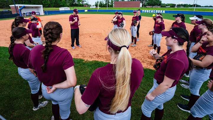 Hokies gather around for a talk in practice ahead of their regional matchup.