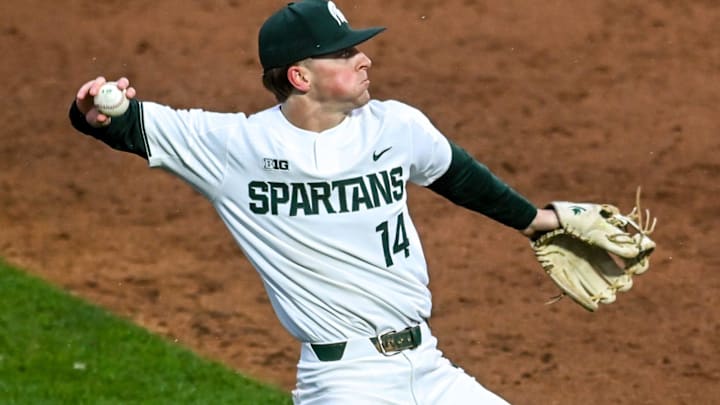 Michigan State's Mitch Jebb fields a ball hit by Michigan during the sixth inning on Friday, April