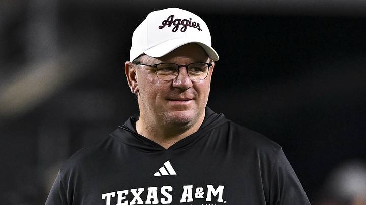 Texas A&M Aggies head coach Mike Elko walks on the field before the game against the New Mexico State Aggies at Kyle Field. Texas A&M Aggies head coach Mike Elko walks on the field before the game against the New Mexico State Aggies at Kyle Field.
