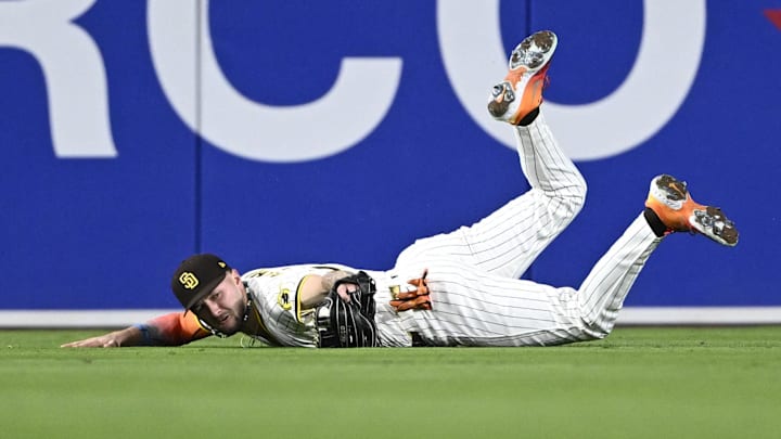 May 12, 2025; San Diego, California, USA; San Diego Padres center fielder Jackson Merrill (3) makes a diving catch on a ball hit by Los Angeles Angels shortstop Zach Neto (9) during the fifth inning at Petco Park. Mandatory Credit: Denis Poroy-Imagn Images