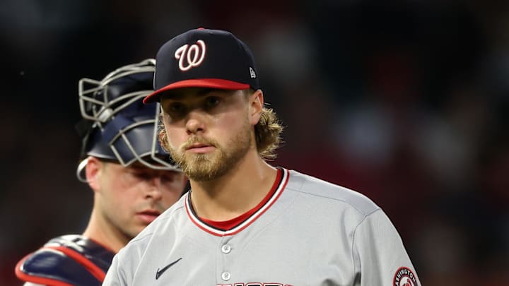 Jun 27, 2025; Anaheim, California, USA;  Washington Nationals starting pitcher Jake Irvin (27) walks back to a dugout after taking out from the game in the fifth inning against the Los Angeles Angels at Angel Stadium. Mandatory Credit: Kiyoshi Mio-Imagn Images