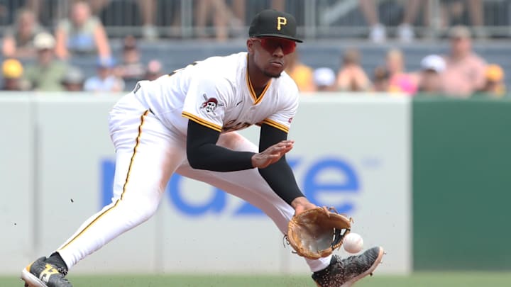Jul 2, 2025; Pittsburgh, Pennsylvania, USA;  Pittsburgh Pirates third baseman Ke'Bryan Hayes (13) fields a ground ball for an out against St. Louis Cardinals third baseman Thomas Saggese (not pictured) during the sixth inning at PNC Park. Mandatory Credit: Charles LeClaire-Imagn Images