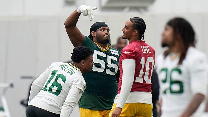 Green Bay Packers defensive tackle Chris McClellan (55) interacts with Green Bay Packers quarterback Jordan Love (10) during the first day of a three-day minicamp at the Don Hutson Center in Ashwaubenon, Wisconsin on Tuesday, June 9, 2026.