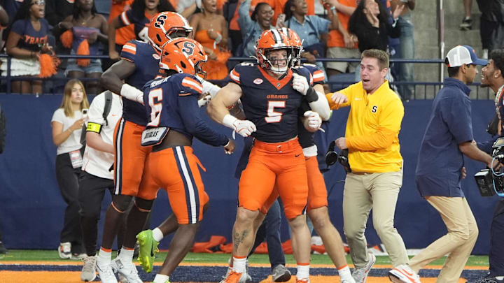 Sep 6, 2025; Syracuse, New York, USA; Syracuse Orange wide receiver Umari Hatcher (5) reacts to breaking up a 4th down pass by the UConn Huskies to secure the victory during overtime at JMA Wireless Dome. Mandatory Credit: Gregory Fisher-Imagn Images Sep 6, 2025; Syracuse, New York, USA; Syracuse Orange wide receiver Umari Hatcher (5) reacts to breaking up a 4th down pass by the UConn Huskies to secure the victory during overtime at JMA Wireless Dome. Mandatory Credit: Gregory Fisher-Imagn Images