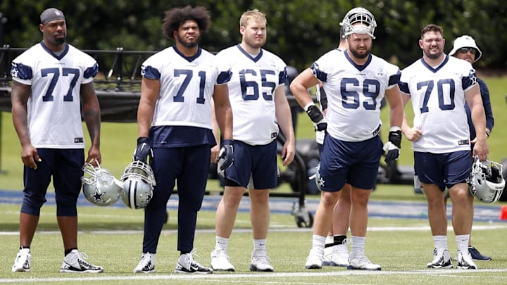  Dallas Cowboys offensive tackle Tyron Smith (77) and offensive tackle La'el Collins (71) and offensive tackle Mitch Hyatt (65) and offensive tackle Brandon Knight (69), and offensive guard Zack Martin (70) on the sidelines during voluntary Organized Team Activities at the Star Training Facility in Frisco, Texas.